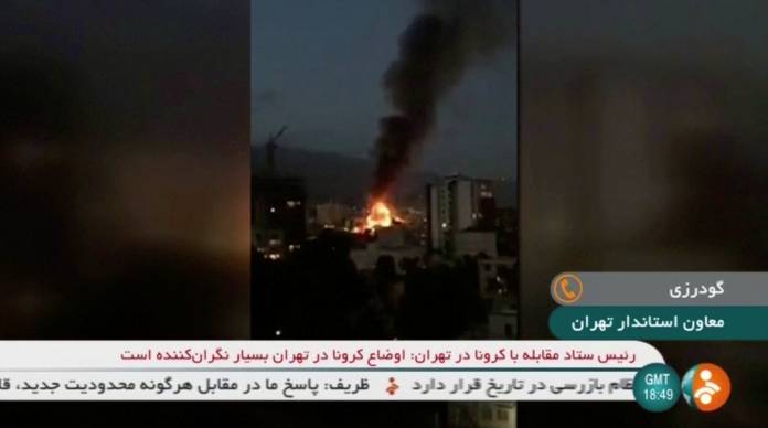 Smoke rises from a building, following an explosion, in Tehran