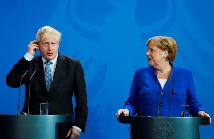 FILE PHOTO: German Chancellor Merkel meets Britain's Prime Minister Johnson at the Chancellery in Berlin