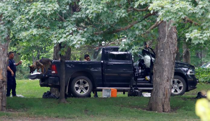 A police dog searches a vehicle at Rideau Hallin Ottawa