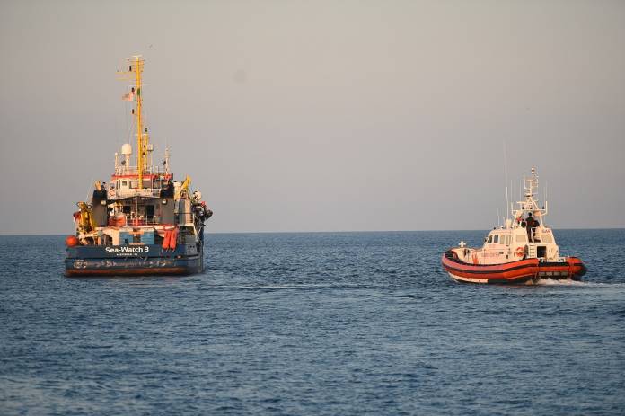 FILE PHOTO: The Sea-Watch 3 rescue ship leaves after migrants disembarked at the port in Lampedusa