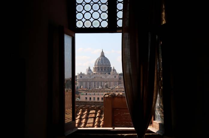 FILE PHOTO: The Dome of St. Peter's Basilica at the Vatican is seen through a window of Sant'Angelo castle in Rome