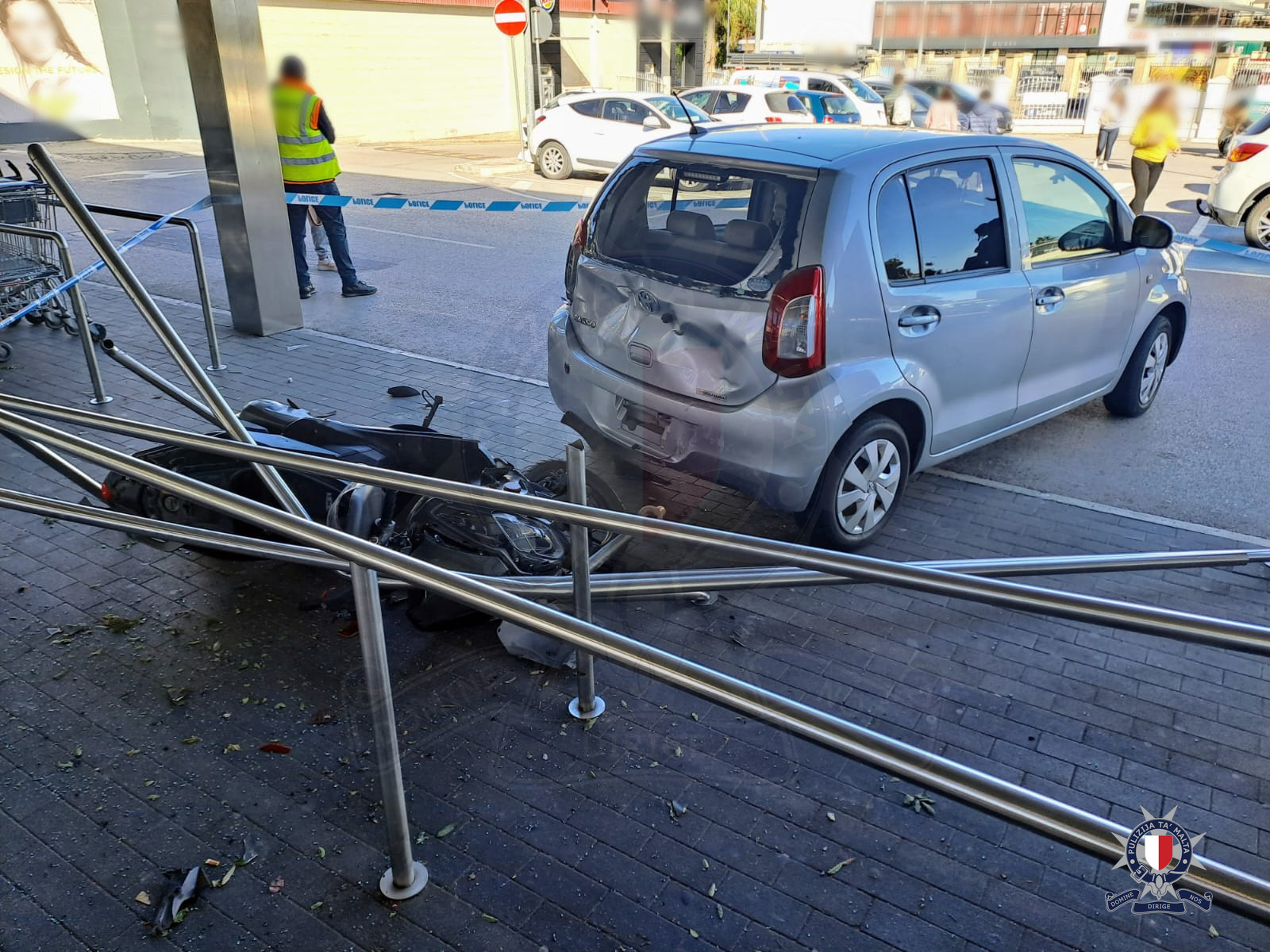 Motorcyclist grievously injured in parking lot collision
