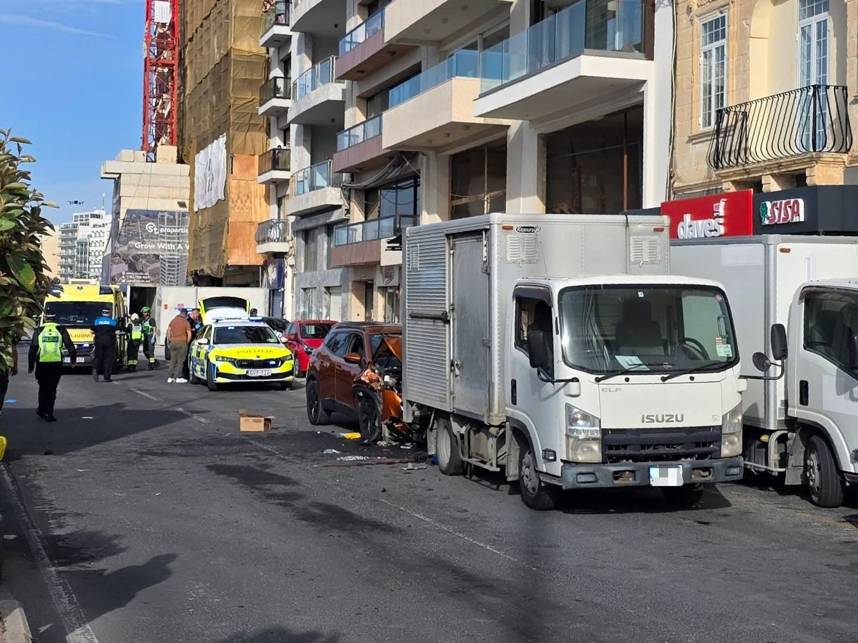Man in critical condition after being trapped between lorry and car in ...